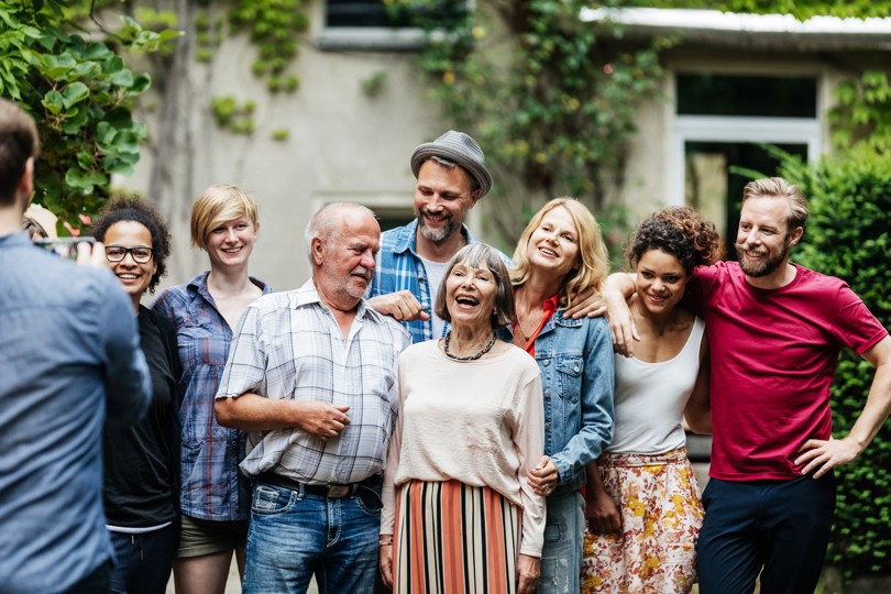 Multi-generational family gathering outdoors